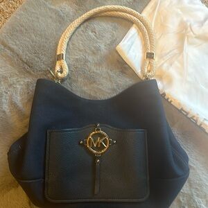 Michael Kors canvas purse. Excellent condition from a pet and smoke free home.